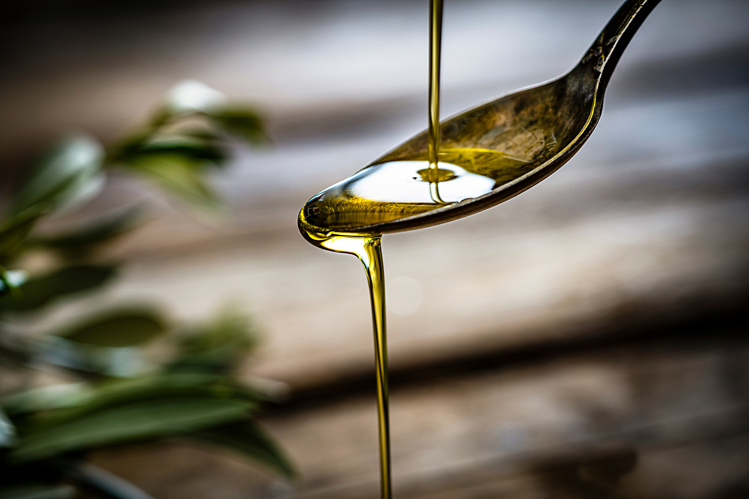 Pouring extra virgin olive oil